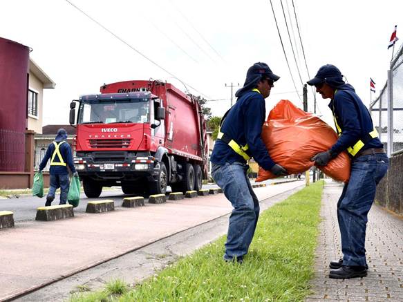 A group of men carrying bags on the side of a road

AI-generated content may be incorrect.